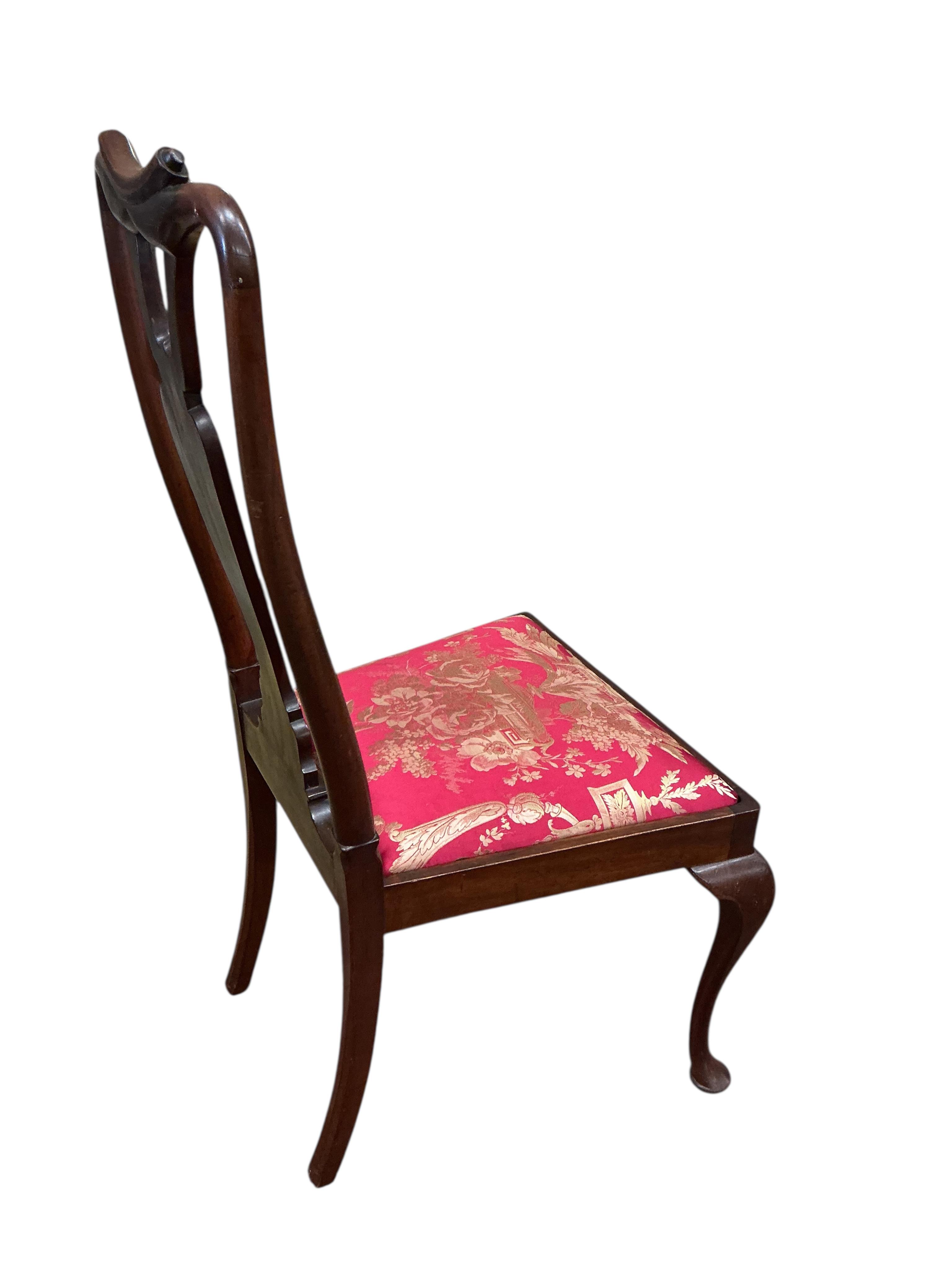 A set of eight early 20th century Queen Anne style mahogany dining chairs with silk brocade drop in seats, two with arms